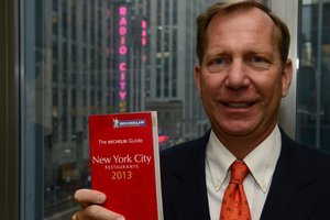 The new International Director of Michelin Guides, Michael Ellis, with the 2013 New York edition. Photo / AFP