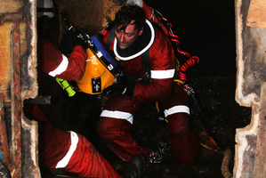 Salvage diver Vinnie Esposito works inside the sunken MV Rena yesterday. Photo / Alan Gibson