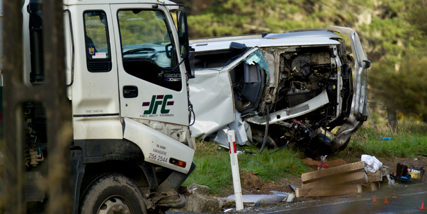The scene of a crash involving a truck and a car on Mill Road in Totara Park where a woman is dead and two toddlers were injured today. Photo / Dean Purcell