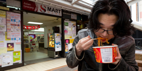 Peter Kim, 22, says S-mart's noodles are not only cheap, but he likes his lunches hot. Photo / Greg Bowker
