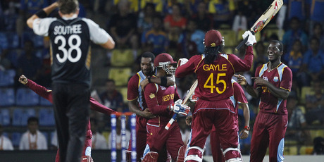 West Indies' captain Darren Sammy, right, celebrates with teammates their Super Over win over New Zealand in the Twenty20 World Cup match in Pallekele, Sri Lanka. Photo / AP