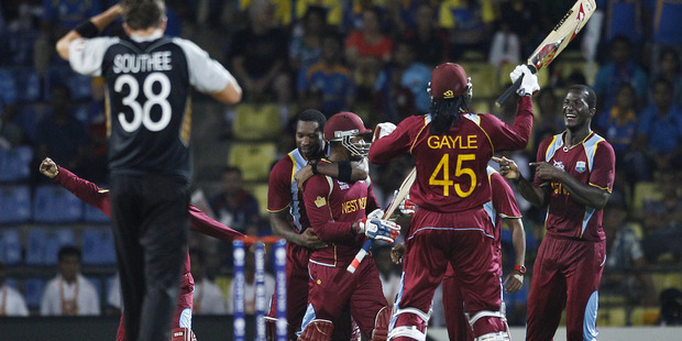 West Indies' captain Darren Sammy, right, celebrates with teammates their Super Over win over New Zealand in the Twenty20 World Cup match in Pallekele, Sri Lanka. Photo / AP