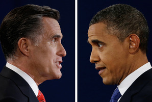 Republican presidential nominee Mitt Romney and President Barack Obama speak during the first presidential debate at the University of Denver. Photo / AP