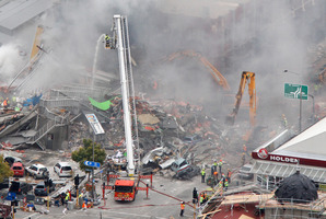 Emergency service staff hunting for survivors amongst the rubble of the CTV Building. Photo / Mark Mitchell