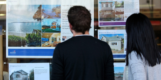 Signs of bubbles include rapid price rises, many people bidding at auctions and houses selling really quickly. Photo / Dean Purcell