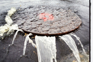 Auckland's trial by rain stressed manholes in Milford. Photo / NZ Herald