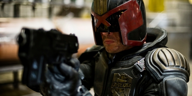 Karl Urban's Judge Dredd keeps his helmet on throughout the entire film. Photo / Supplied