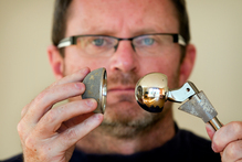 James Elliott with the artificial hip joint that he had to have replaced because of a design fault. File photo / Natalie Slade