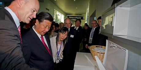 Fisher and Paykel CEO Stuart Broadhurst, left, shows off the company's appliances to Xi Jinping Chinese Vice President, during a recent state visit. Photo / NZ Herald