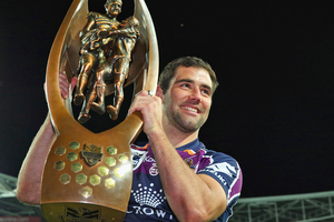 Cameron Smith holds up the premiership trophy after Melbourne beat Canterbury 14-4 in the NRL final. Photo / Getty Images