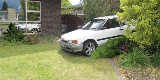 A driver and his passenger had a lucky escape when their car smashed through the front fence of a Pirimai, Napier, home. Photo / Supplied