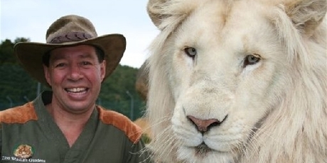 Lion Man Craig Busch poses with a very large lion. Photo / Supplied