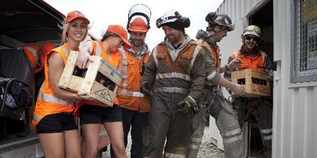 Tui girls Kalinda and Alice deliver refreshments to workers from Geovert Ltd and Higgins Contractors - Lachie Avery, Dan Cochrane, Andy Barlow and Fraser Harvey who helped re-open the Manawatu Gorge. Photo / Mike Watkins