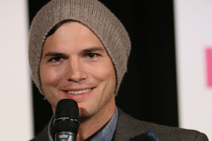 Ashton Kutcher rushed home to find the massive number of policed deployed to the incident. Photo / Getty Images
