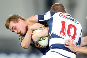Hayden Parker of Otago and Gareth Anscombe of Auckland tussle for the ball. Photo / Getty Images