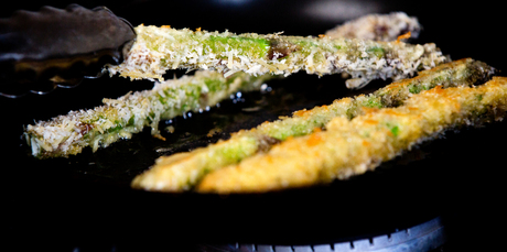 Cornmeal crumbed asparagus cooked over high heat, turned frequently, until they turn golden. Photo / Babiche Martens