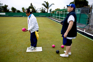 Poa Mafileo (in white) aims for the jack as Lorraine Beazley looks on at the Grey Lynn Bowling Club. Photo / Dean Purcell