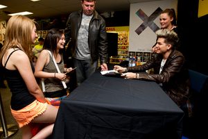 US singer Adam Lambert signs CDs for hundreds of fans at JB Hi Fi on Queen Street Wednesday. Photo / Dean Purcell