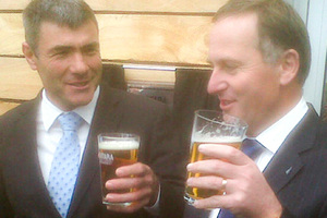 National MP Nathan Guy and John Key share a beer in Paraparaumu. Photo / APN