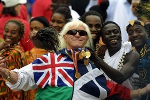 2002 file photo of Jimmy Savile, a television and radio celebrity joins in with people representing Commonwealth countries at Buckingham Palace during the Golden Jubilee celebrations. Photo / AFP
