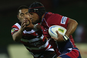 Tevita Koloamatangi of Tasman fends off Tyrone Lefau of Counties Manukau. Photo / Getty Images