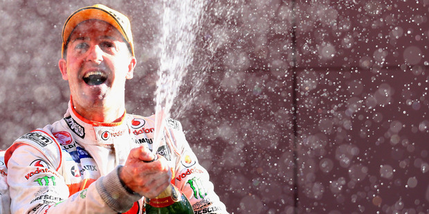 Jamie Whincup celebrates on the Bathurst podium yesterday afternoon. Photo / Getty Images