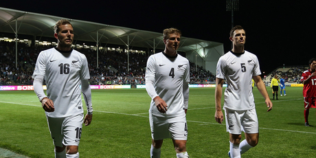 Jeremy Brockie, Ben Sigmund and Tommy Smith of the All Whites leave the pitch after one of the floodlights went out during the 2014 FIFA World Cup Qualifier match. Photo / Getty Images.