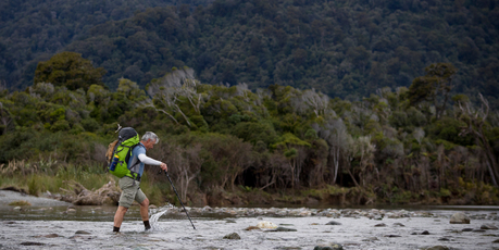 Geoff Wilson makes his way over the West Coast's Hope River. Photo / Greg Bowker
