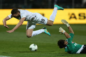 Chris Killen of the All Whites collides with goalkeeper Mikael Roche of Tahiti. Photo / Getty Images