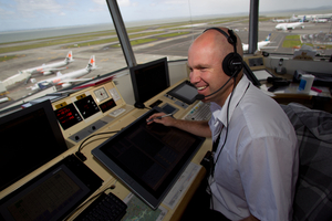 Steve Vaughan at his post in the Auckland Airport control tower from which he helps to oversee up to 44 landings and takeoffs an hour. Photo / Richard Robinson
