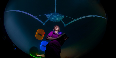 Melissa Nordhaus underneath the projection dome in War of the Worlds. Photo / Chris Loufte