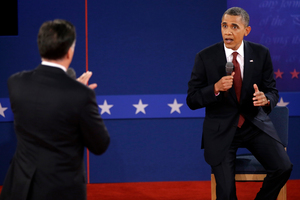 Republican presidential nominee Mitt Romney and President Barack Obama speak during the second presidential debate. Photo / AP