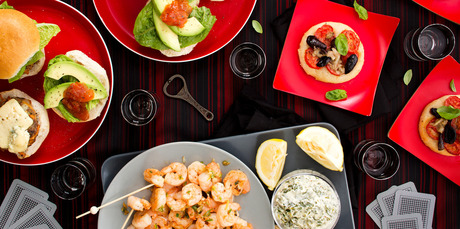 Clockwise from above left: Blue cheese, beef and avocado mini burgers; pizzette; and chilli prawns with rocket lemon mayo. Photo / Babiche Martens