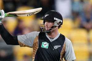 New Zealand's Martin Guptill raises his bat during a T 20 match against south Africa earlier this year. Photo / Mark Mitchell