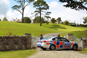 The police raid on Kim Dotcom's Coatesville mansion. Photo / Herald on Sunday
