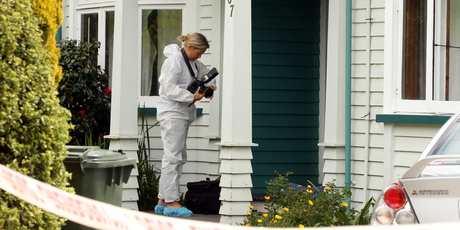 Police at the scene of the fatal stabbing. Photo / Paul Taylor
