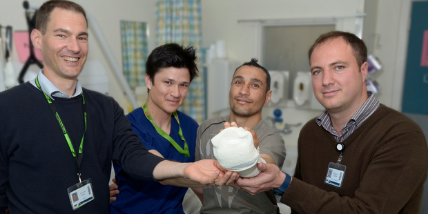 Tamati Parkes, centre, has made a promise to his surgical team to stop smoking. Photo / Supplied