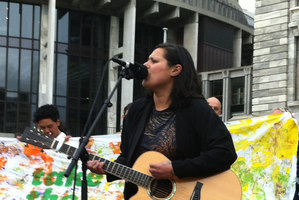 Anika Moa performs as part of the rally against child poverty. Photo / Kate Shuttleworth