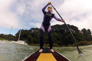 Rachel Grunwell tries paddleboarding at Little Shoal Bay on Auckland's North Shore. Photo / Getty Images