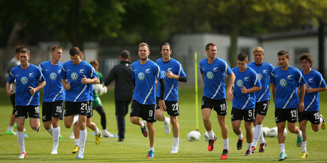 The New Zealand All Whites warm up for training in preparation for the game tomorrow in Christchurch. Photo / Getty Images