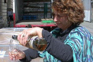 New Zealand Whisky Co manager Deb Preston celebrates the shipment of whisky about to begin its journey from Oamaru to the home of the whisky, Scotland. Photo / David Bruce.