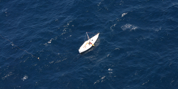 When Glenn Ey's yacht Streaker was hit by a large wave, he set off a distress beacon and two flights - including one from Air NZ - helped pinpoint his location. Photo / AMSA