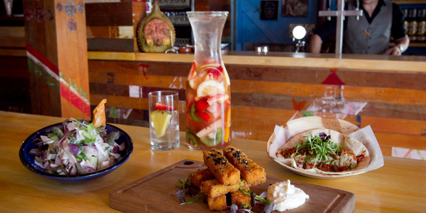 Takapuna Mexico's ceviche, patatas de maiz and chicken taco with a jug of sangria. Photo / Natalie Slade