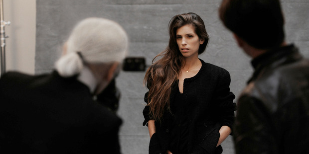 Karl Lagerfeld at work for his new book about Chanel's iconic little black jacket. Photo / Supplied