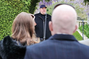 Kim Dotcom speaks to guests at the party at his mansion. Photo / Supplied