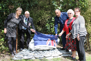 Widow Wendy Lynch, Makaawhio kaumatua Richard Wallace, acting Police Commissioner Viv Rickard and widows Lorraine Krom and Kay Dowie unveil the memorial plaque. Photo / Hokitika Guardian