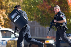 Police and swat team members respond to a call of a shooting at the Azana Spa in Brookfield, Wisconsin. Photo / AP