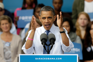 President Barack Obama gestures as he speaks to supporters during a campaign stop at The Mississippi Valley Fairgrounds. Photo / AP