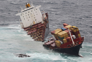 The container ship Rena sits in two pieces on Astrolabe Reef off the coast of Tauranga. Photo / Joel Ford
