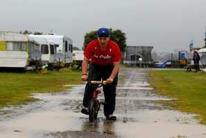 Josh Townley 14, from Auckland has some fun in the rain at the Kopua Holiday Park at Raglan. Photo / NZ Herald
